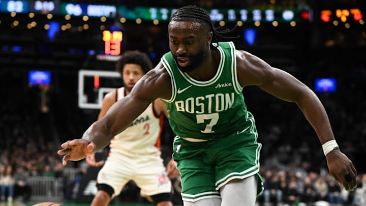 Dec 4, 2024; Boston, Massachusetts, USA; Boston Celtics guard Jaylen Brown (7) reaches for a loose ball against the Detroit Pistons during the third quarter at the TD Garden. Mandatory Credit: Brian Fluharty-Imagn Images