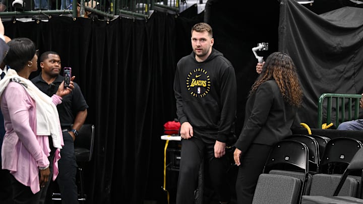 Apr 9, 2025; Dallas, Texas, USA; Los Angeles Lakers guard Luka Doncic (77) walks on to the court before the game between the Dallas Mavericks and the Los Angeles Lakers during the first quarter at the  American Airlines Center. Mandatory Credit: Jerome Miron-Imagn Images
