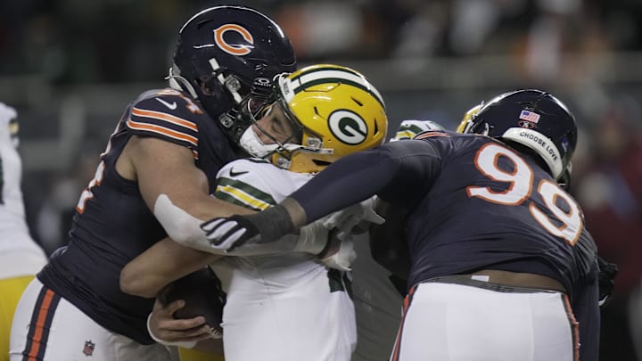 Dec 20, 2025; Chicago, Illinois, USA; Chicago Bears defensive end Austin Booker (94) sacks and injures Green Bay Packers quarterback Jordan Love (10)  during the second quarter at Soldier Field. Love left the game and the Bears were penalized for the hit. Mandatory Credit: Mark Hoffman-USA TODAY Network via Imagn Images