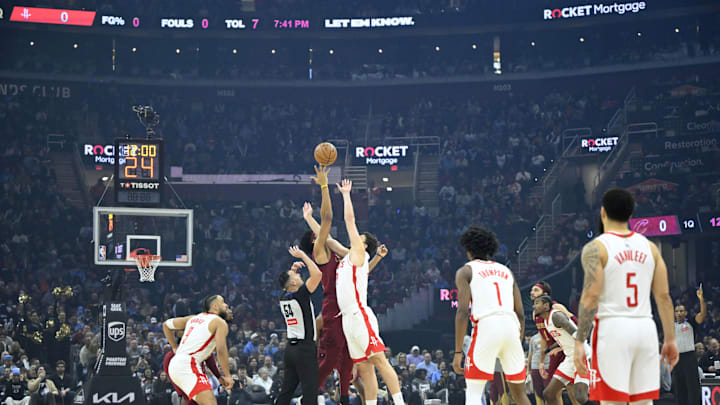 Jan 25, 2025; Cleveland, Ohio, USA; Cleveland Cavaliers center Jarrett Allen (31) and Houston Rockets center Alperen Sengun (28) reach for the opening tip at Rocket Mortgage FieldHouse. Mandatory Credit: David Richard-Imagn Images