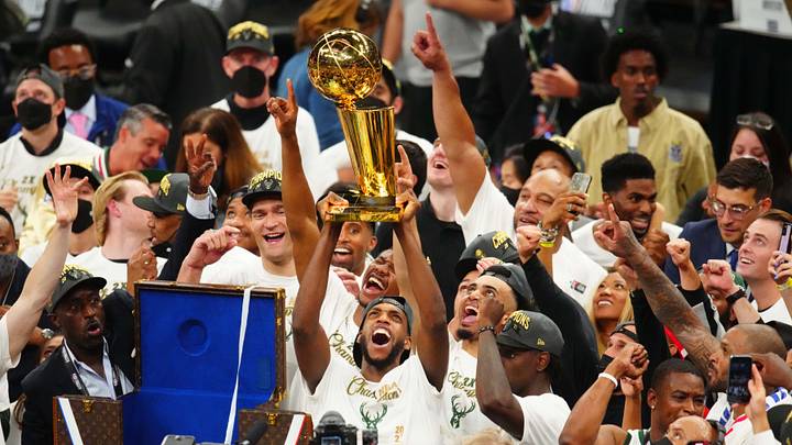 Jul 20, 2021; Milwaukee, Wisconsin, USA; Milwaukee Bucks forward Khris Middleton (22) celebrates with the Larry O'Brien Trophy after game six of the 2021 NBA Finals and the championship against the Phoenix Suns at Fiserv Forum. Mandatory Credit: Mark J. Rebilas-USA TODAY Sports Jul 20, 2021; Milwaukee, Wisconsin, USA; Milwaukee Bucks forward Khris Middleton (22) celebrates with the Larry O'Brien Trophy after game six of the 2021 NBA Finals and the championship against the Phoenix Suns at Fiserv Forum. Mandatory Credit: Mark J. Rebilas-USA TODAY Sports