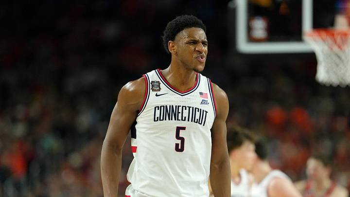 Apr 4, 2026; Indianapolis, IN, USA; UConn Huskies forward Tarris Reed Jr. (5) reacts after a play against the Illinois Fighting Illini during the first half of a semifinal of the Final Four of the men's 2026 NCAA Tournament at Lucas Oil Stadium. Mandatory Credit: Bob Donnan-Imagn Images