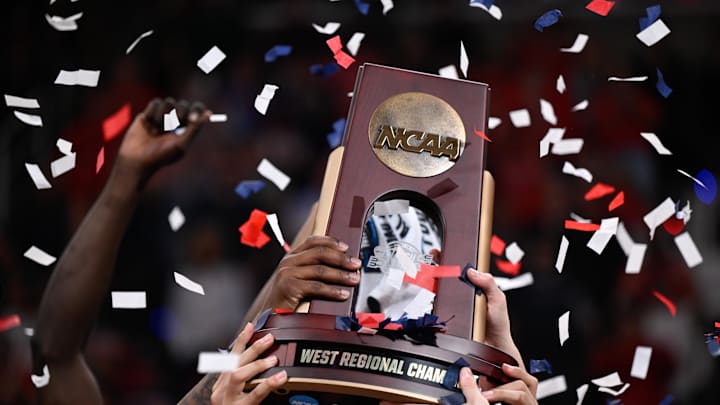 Mar 28, 2026; San Jose, CA, USA; The Arizona Wildcats celebrates with the West Regional Championship trophy after an Elite Eight game against the Purdue Boilermakers of the West Regional of the men's 2026 NCAA Tournament at SAP Center. Mandatory Credit: Eakin Howard-Imagn Images