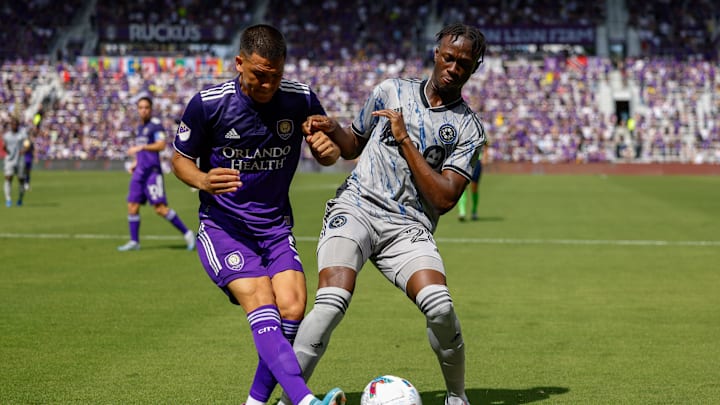 Feb 27, 2022; Orlando, Florida, USA;  CF Montr  al midfielder Isma  l Kon   (28) and Orlando City