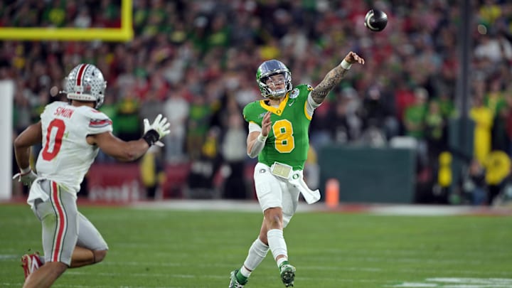 Jan 1, 2025; Pasadena, CA, USA; Oregon Ducks quarterback Dillon Gabriel (8) passes against Ohio State Buckeyes linebacker Cody Simon (0) in the second half in the 2025 Rose Bowl college football quarterfinal game at Rose Bowl Stadium. Mandatory Credit: Jayne Kamin-Oncea-Imagn Images