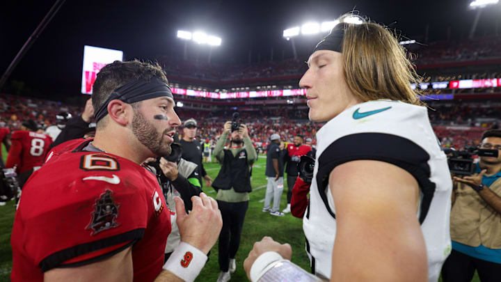 Dec 24, 2023; Tampa, Florida, USA;  Tampa Bay Buccaneers quarterback Baker Mayfield (6) greats Jacksonville Jaguars quarterback Trevor Lawrence (16) after a game at Raymond James Stadium. Mandatory Credit: Nathan Ray Seebeck-USA TODAY Sports