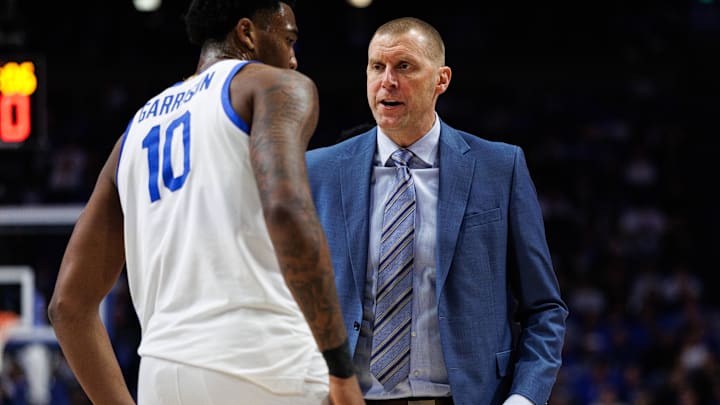 Dec 9, 2025; Lexington, Kentucky, USA; Kentucky Wildcats head coach Mark Pope talks with forward Brandon Garrison (10) during the first half against the North Carolina Central Eagles at Rupp Arena at Central Bank Center. Mandatory Credit: Jordan Prather-Imagn Images Dec 9, 2025; Lexington, Kentucky, USA; Kentucky Wildcats head coach Mark Pope talks with forward Brandon Garrison (10) during the first half against the North Carolina Central Eagles at Rupp Arena at Central Bank Center. Mandatory Credit: Jordan Prather-Imagn Images