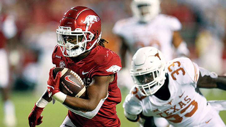 Arkansas running back AJ Green runs for a touchdown in a blowout of Texas at Razorbacks Stadium in 2021. Arkansas running back AJ Green runs for a touchdown in a blowout of Texas at Razorbacks Stadium in 2021.