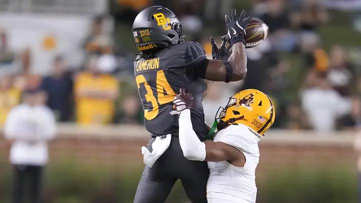 Sep 20, 2025; Waco, Texas, USA; Baylor Bears wide receiver Josh Cameron (34) makes a catch as Arizona State Sun Devils defensive back Keith Abney II (1) defends during the first half at McLane Stadium. Sep 20, 2025; Waco, Texas, USA; Baylor Bears wide receiver Josh Cameron (34) makes a catch as Arizona State Sun Devils defensive back Keith Abney II (1) defends during the first half at McLane Stadium.