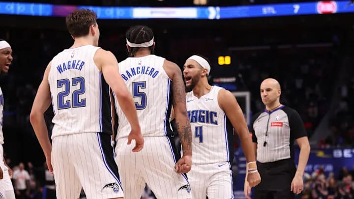 Orlando Magic guard Jalen Suggs celebrates with forwards Franz Wagner and Paolo Banchero.