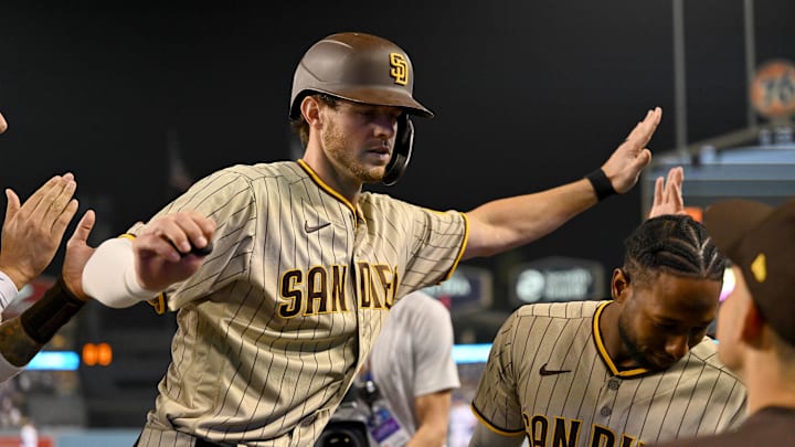Oct 11, 2022; Los Angeles, California, USA; San Diego Padres right fielder Wil Myers (5) celebrates after hitting a home run during the fifth inning of game one of the NLDS for the 2022 MLB Playoffs against the Los Angeles Dodgers at Dodger Stadium. Mandatory Credit: Jayne Kamin-Oncea-Imagn Images
