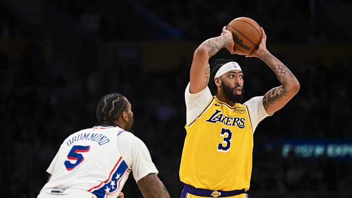Nov 8, 2024; Los Angeles, California, USA; Los Angeles Lakers forward Anthony Davis (3) looks to pass against Philadelphia 76ers center Andre Drummond (5) during the second half at Crypto.com Arena. Mandatory Credit: Jonathan Hui-Imagn Images