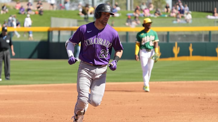 Mar 6, 2026; Mesa, Arizona, USA; Colorado Rockies catcher Brett Sullivan (26) runs after hitting a three run home run against the Athletics in the first inning at Hohokam Stadium. Mandatory Credit: Rick Scuteri-Imagn Images