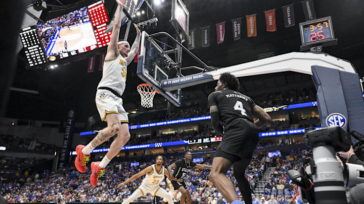 Mar 13, 2025; Nashville, TN, USA;  Missouri Tigers guard Jacob Crews (35) jumps as Mississippi State Bulldogs forward Cameron Matthews (4) throws the ball in during the second half at Bridgestone Arena. Mandatory Credit: Steve Roberts-Imagn Images