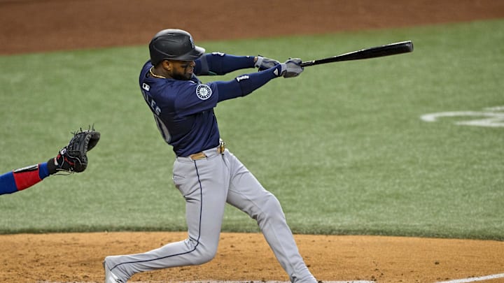 Seattle Mariners right fielder Victor Robles (10) hits a single against the Texas Rangers during the sixth inning at Globe Life Field on Sept 22.