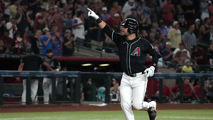 Aug 14, 2024; Phoenix, Arizona, USA; Arizona Diamondbacks third base Eugenio Suarez (28) reacts after hitting a grand slam against the Colorado Rockies in the sixth inning at Chase Field. Mandatory Credit: Rick Scuteri-Imagn Images