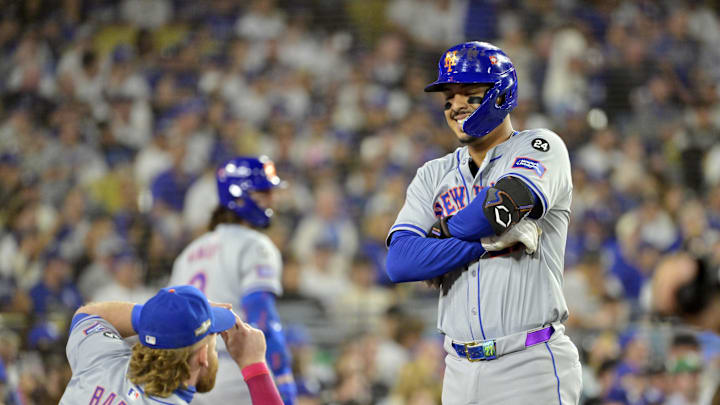 Oct 20, 2024; Los Angeles, California, USA; New York Mets third baseman Mark Vientos (27) celebrates with outfielder Harrison Bader (44) after hitting a two run home run in the fourth inning against the Los Angeles Dodgers during game six of the NLCS for the 2024 MLB playoffs at Dodger Stadium. 