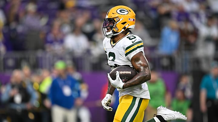 Green Bay Packers running back Josh Jacobs runs the ball against the Minnesota Vikings