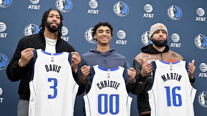 Feb 7, 2025; Dallas, TX, USA; Dallas Mavericks forward Anthony Davis (3) and guard Max Christie (00) and forward Caleb Martin (16) pose for a photo with their new Mavs jerseys during a press conference at the Dallas Mavericks practice facility. Mandatory Credit: Jerome Miron-Imagn Images