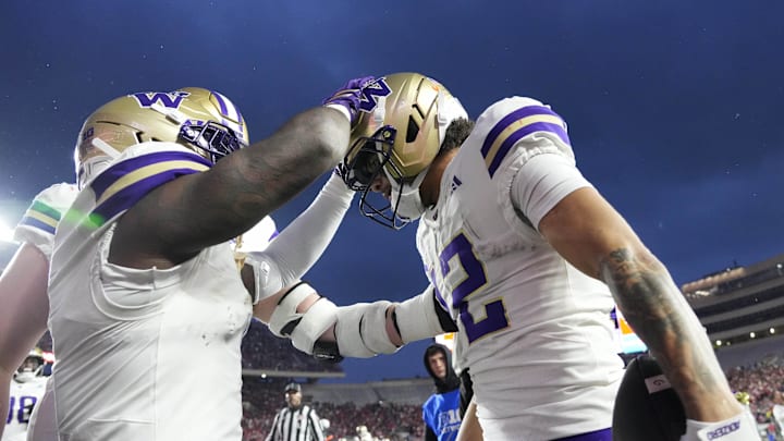 Nov 8, 2025; Madison, Wisconsin, USA;  Washington Huskies wide receiver Denzel Boston (12) celebrates after scoring a touchdown during the second quarter against the Wisconsin Badgers at Camp Randall Stadium. Mandatory Credit: Jeff Hanisch-Imagn Images