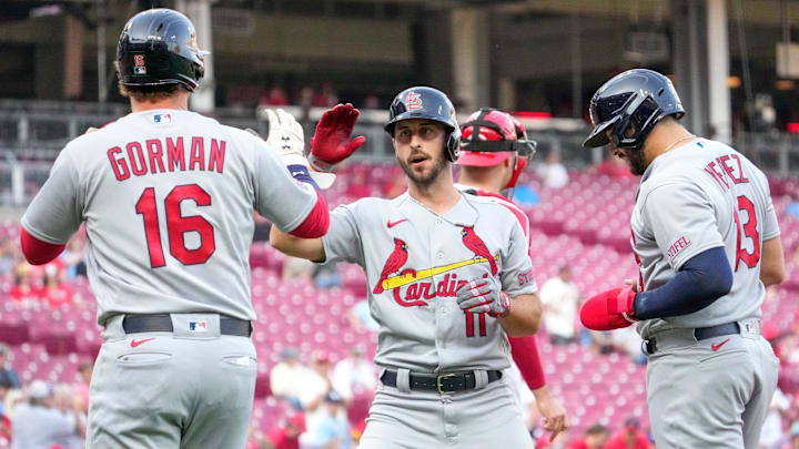 St. Louis Cardinals shortstop Paul DeJong (11) celebrates with designated hitter Nolan Gorman (16)