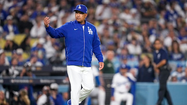 Los Angeles Dodgers manager Dave Roberts makes a pitching change in the middle of a Will Benson at bat in the eighth inning of the MLB National League Wild Card Game 2 between the Los Angeles Dodgers and the Cincinnati Reds at Dodger Stadium in Los Angeles on Wednesday, Oct. 1, 2025. The Reds were eliminated from the postseason with an 8-4 loss to the reining World Series Champions La Dodgers. Los Angeles Dodgers manager Dave Roberts makes a pitching change in the middle of a Will Benson at bat in the eighth inning of the MLB National League Wild Card Game 2 between the Los Angeles Dodgers and the Cincinnati Reds at Dodger Stadium in Los Angeles on Wednesday, Oct. 1, 2025. The Reds were eliminated from the postseason with an 8-4 loss to the reining World Series Champions La Dodgers.
