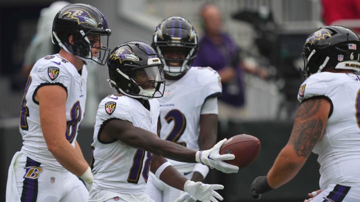 Aug 17, 2024; Baltimore, Maryland, USA; Baltimore Ravens wide receiver Dayton Wade (18) hands the ball to a lineman following his third quarter touchdown catch against the Atlanta Falcons at M&T Bank Stadium. Mandatory Credit: Mitch Stringer-USA TODAY Sports Aug 17, 2024; Baltimore, Maryland, USA; Baltimore Ravens wide receiver Dayton Wade (18) hands the ball to a lineman following his third quarter touchdown catch against the Atlanta Falcons at M&T Bank Stadium. Mandatory Credit: Mitch Stringer-USA TODAY Sports