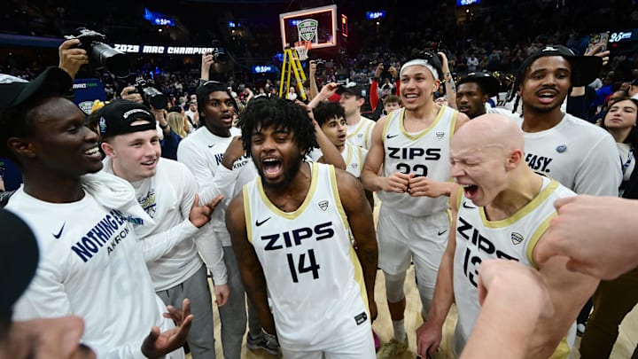 Mar 15, 2025; Cleveland, OH, USA;  The Akron Zips celebrate after winning the MAC Conference Tournament Championship game against the Miami (Oh) Redhawks at Rocket Arena. Mandatory Credit: Ken Blaze-Imagn Images