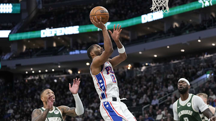 Feb 9, 2025; Milwaukee, Wisconsin, USA;  Philadelphia 76ers guard Jared Butler (12) shoots during the second quarter against the Milwaukee Bucks at Fiserv Forum. Mandatory Credit: Jeff Hanisch-Imagn Images