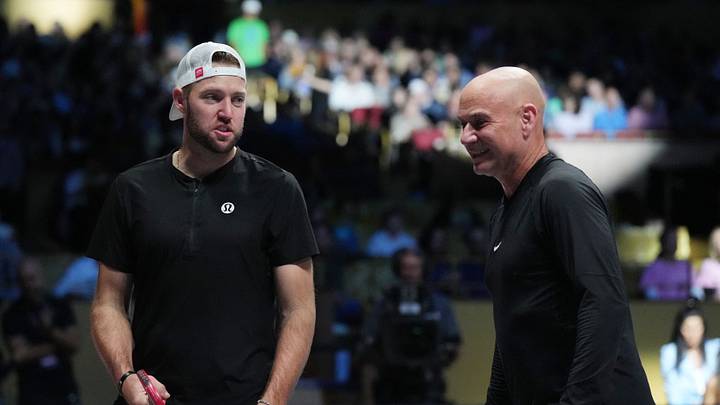 Feb 4, 2024; Hollywood, FL 33314, FL, USA;  Andre Agassi (right) and Jack Sock discuss strategy during Pickleball Slam 2 at Hard Rock Live at Seminole Hard Rock Hotel & Casino. Mandatory Credit: Jim Rassol-USA TODAY Sports