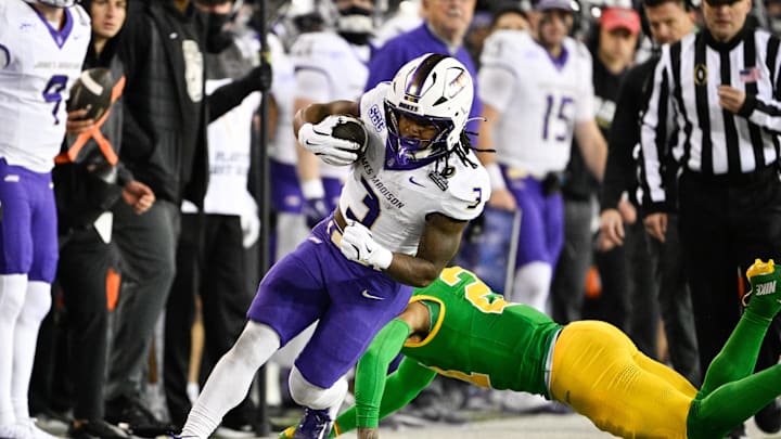 Dec 20, 2025; Eugene, OR, USA; James Madison Dukes running back Wayne Knight (3) rushes during the second quarter against the Oregon Ducks at Autzen Stadium. Mandatory Credit: Troy Wayrynen-Imagn Images
