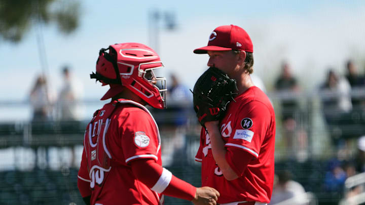 Feb 24, 2025; Goodyear, Arizona, USA; Cincinnati Reds catcher Jose Trevino (35) Hunter Feduccia (67) talks with Cincinnati Reds pitcher Brady Singer (51) during the second inning of the game against the Los Angeles Dodgers at Goodyear Ballpark. Mandatory Credit: Joe Camporeale-Imagn Images