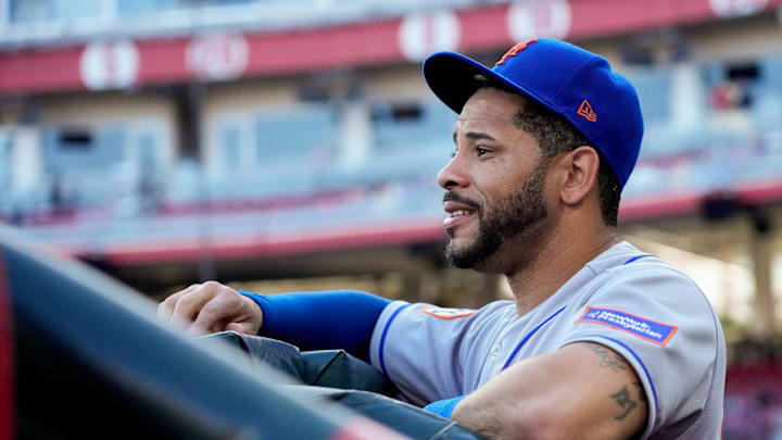 New York Mets designated hitter Tommy Pham (28) watches from the dugout before the first inning of