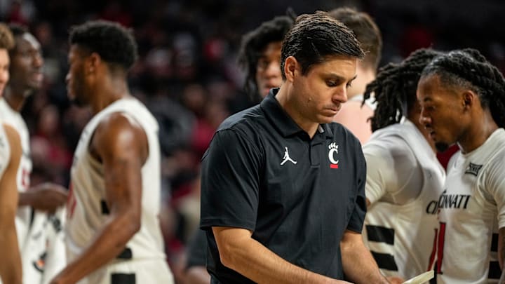 Cincinnati Bearcats head coach Wes Miller looks at his notes in the second half of the NCAA basketball game between the Cincinnati Bearcats and the West Virginia Mountaineers at Fifth Third Arena in Cincinnati on Sunday, Feb. 2, 2025. The Bearcats lost, 63-50. Cincinnati Bearcats head coach Wes Miller looks at his notes in the second half of the NCAA basketball game between the Cincinnati Bearcats and the West Virginia Mountaineers at Fifth Third Arena in Cincinnati on Sunday, Feb. 2, 2025. The Bearcats lost, 63-50.