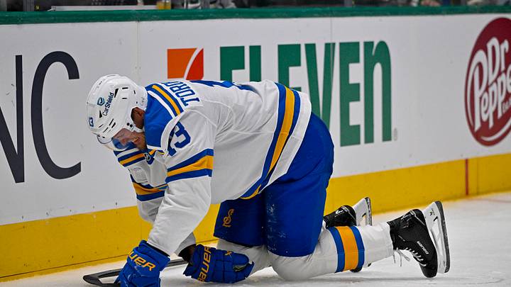 Oct 2, 2026; Dallas, Texas, USA; St. Louis Blues right wing Alexey Toropchenko (13) suffers an apparent upper body injury during the second period against the Dallas Stars at the American Airlines Center. Mandatory Credit: Jerome Miron-Imagn Images