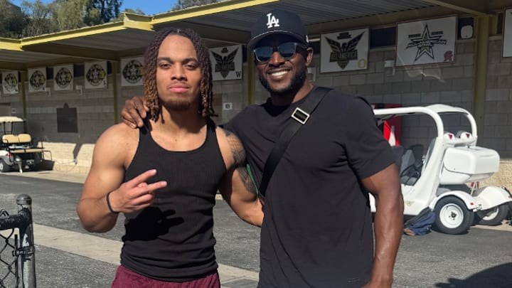 Deshonne Redeaux poses with USC legend Reggie Bush