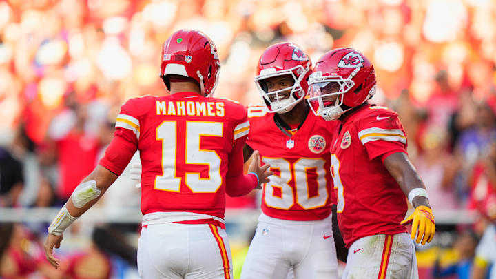 Sep 28, 2025; Kansas City, Missouri, USA;  Kansas City Chiefs wide receiver Tyquan Thornton (80) celebrates with Kansas City Chiefs quarterback Patrick Mahomes (15) and Kansas City Chiefs wide receiver JuJu Smith-Schuster (9) after scoring a touchdown during the third quarter at GEHA Field at Arrowhead Stadium. Mandatory Credit: Jay Biggerstaff-Imagn Images