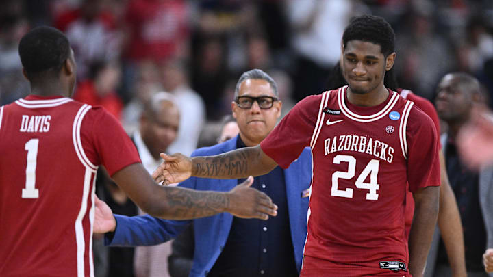 Mar 22, 2025; Providence, RI, USA; Arkansas Razorbacks forward Billy Richmond III (24) and guard Johnell Davis (1) celebrate after a time out during the second half of a second round men’s NCAA Tournament game against the St. John's Red Storm at Amica Mutual Pavilion. Mandatory Credit: Brian Fluharty-Imagn Images