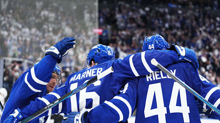 Apr 27, 2024; Toronto, Ontario, CAN; Toronto Maple Leafs right wing Mitch Marner (16) scores a goal and celebrates with center Max Domi (11) and defenseman Morgan Rielly (44) against the Boston Bruins during the third period in game four of the first round of the 2024 Stanley Cup Playoffs at Scotiabank Arena. Mandatory Credit: Nick Turchiaro-USA TODAY 