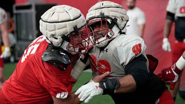 Wisconsin offensive lineman James Durand (65) and nose tackle Curt Neal (92) are shown during spring football practice Thursday, April 25, 2024 in Madison, Wisconsin. The Wisconsin Badgers football team plays their season opener against Western Michigan on August 31.