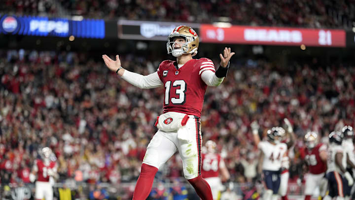 Dec 28, 2025; Santa Clara, California, USA; San Francisco 49ers quarterback Brock Purdy (13) celebrates after scoring a touchdown against the Chicago Bears in the first half at Levi's Stadium. 