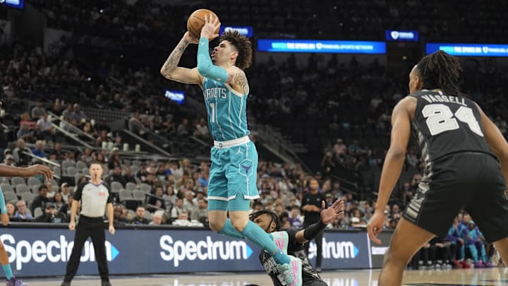 Mar 14, 2025; San Antonio, Texas, USA; Charlotte Hornets guard LaMelo Ball (1) shoots over San Antonio Spurs guard Stephon Castle (5) during the first half at Frost Bank Center. Mandatory Credit: Scott Wachter-Imagn Images