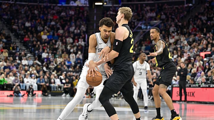 Nov 26, 2024; Salt Lake City, Utah, USA; San Antonio Spurs forward/center Victor Wembanyama (1) collides with Utah Jazz forward/center Lauri Markkanen (23) during the second half at Delta Center. Mandatory Credit: Christopher Creveling-Imagn Images Nov 26, 2024; Salt Lake City, Utah, USA; San Antonio Spurs forward/center Victor Wembanyama (1) collides with Utah Jazz forward/center Lauri Markkanen (23) during the second half at Delta Center. Mandatory Credit: Christopher Creveling-Imagn Images