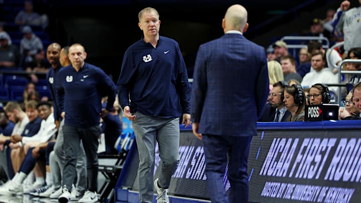 Mar 20, 2025; Lexington, KY, USA; Utah State Aggies head coach Jerrod Calhoun greets UCLA Bruins head coach Mick Cornin after their game in the first round of the NCAA Tournament at Rupp Arena. Mar 20, 2025; Lexington, KY, USA; Utah State Aggies head coach Jerrod Calhoun greets UCLA Bruins head coach Mick Cornin after their game in the first round of the NCAA Tournament at Rupp Arena.