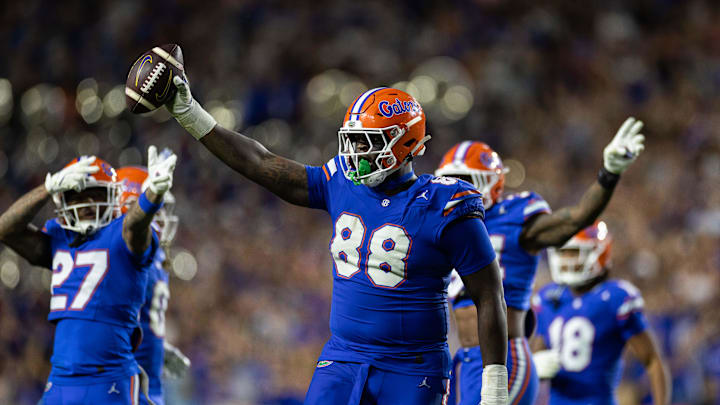 Nov 16, 2024; Gainesville, Florida, USA; Florida Gators defensive lineman Caleb Banks (88) celebrates with the ball after a fumble recovery against the LSU Tigers during the second half at Ben Hill Griffin Stadium. Mandatory Credit: Matt Pendleton-Imagn Images