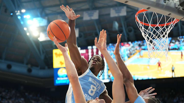 Dec 30, 2025; Chapel Hill, North Carolina, USA; North Carolina Tar Heels forward Caleb Wilson (8) blocks the shot of Florida State Seminoles forward Alex Steen (25) as North Carolina Tar Heels forward Jarin Stevenson (15) helps defend in the first half at Dean E. Smith Center. Mandatory Credit: Bob Donnan-Imagn Images Dec 30, 2025; Chapel Hill, North Carolina, USA; North Carolina Tar Heels forward Caleb Wilson (8) blocks the shot of Florida State Seminoles forward Alex Steen (25) as North Carolina Tar Heels forward Jarin Stevenson (15) helps defend in the first half at Dean E. Smith Center. Mandatory Credit: Bob Donnan-Imagn Images