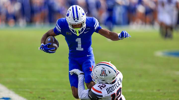 Sep 12, 2026; Provo, Utah, USA;  BYU Cougars wide receiver Legend Glasker (1) runs after a catch against Arizona Wildcats cornerback Dwight Bootle II (12) during the second half at LaVell Edwards Stadium.  Mandatory Credit: Rob Gray-Imagn Images