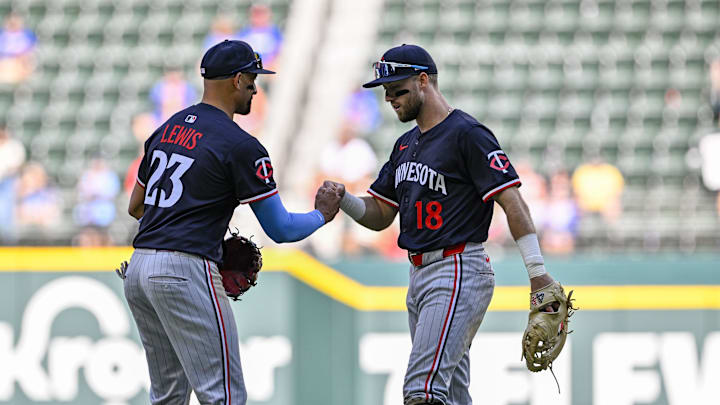 Sep 25, 2025; Arlington, Texas, USA; Minnesota Twins third baseman Royce Lewis (23) and second baseman Kody Clemens (18) celebrate after getting the final out of the game against the Texas Rangers at Globe Life Field. Mandatory Credit: Jerome Miron-Imagn Images
