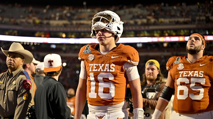 Dec 21, 2024; Austin, Texas, USA; Texas Longhorns quarterback Arch Manning (16) walks off the field after UT defeats the Clemson Tigers in the CFP National Playoff first round game at Darrell K Royal-Texas Memorial Stadium. Mandatory Credit: Jerome Miron-Imagn Images