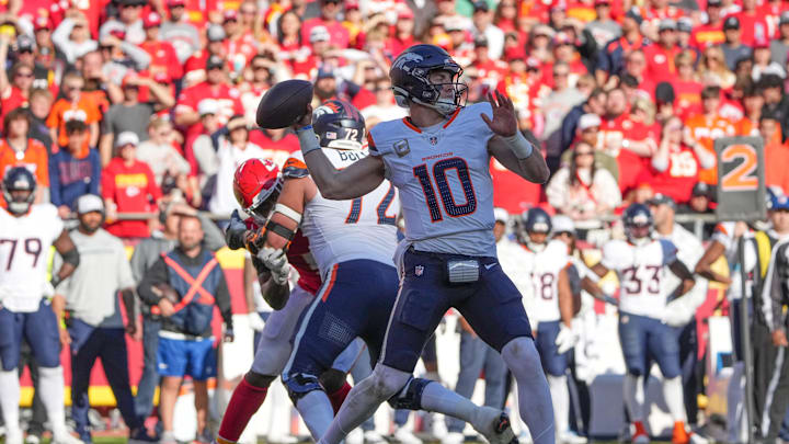 Nov 10, 2024; Kansas City, Missouri, USA; Denver Broncos quarterback Bo Nix (10) throws a pass against the Kansas City Chiefs during the second half at GEHA Field at Arrowhead Stadium. Mandatory Credit: Denny Medley-Imagn Images